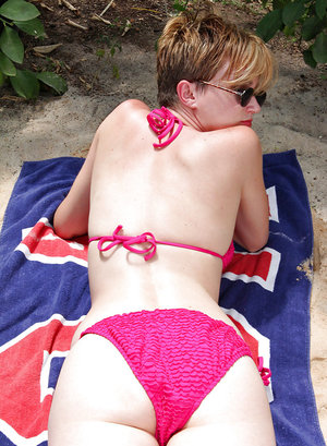 18 year old girl Katie Lewis stands naked after undressing in her bedroom